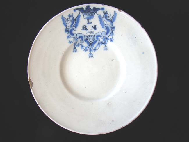 A RARE Dutch Delft blue and white monogrammed plate dated 1688